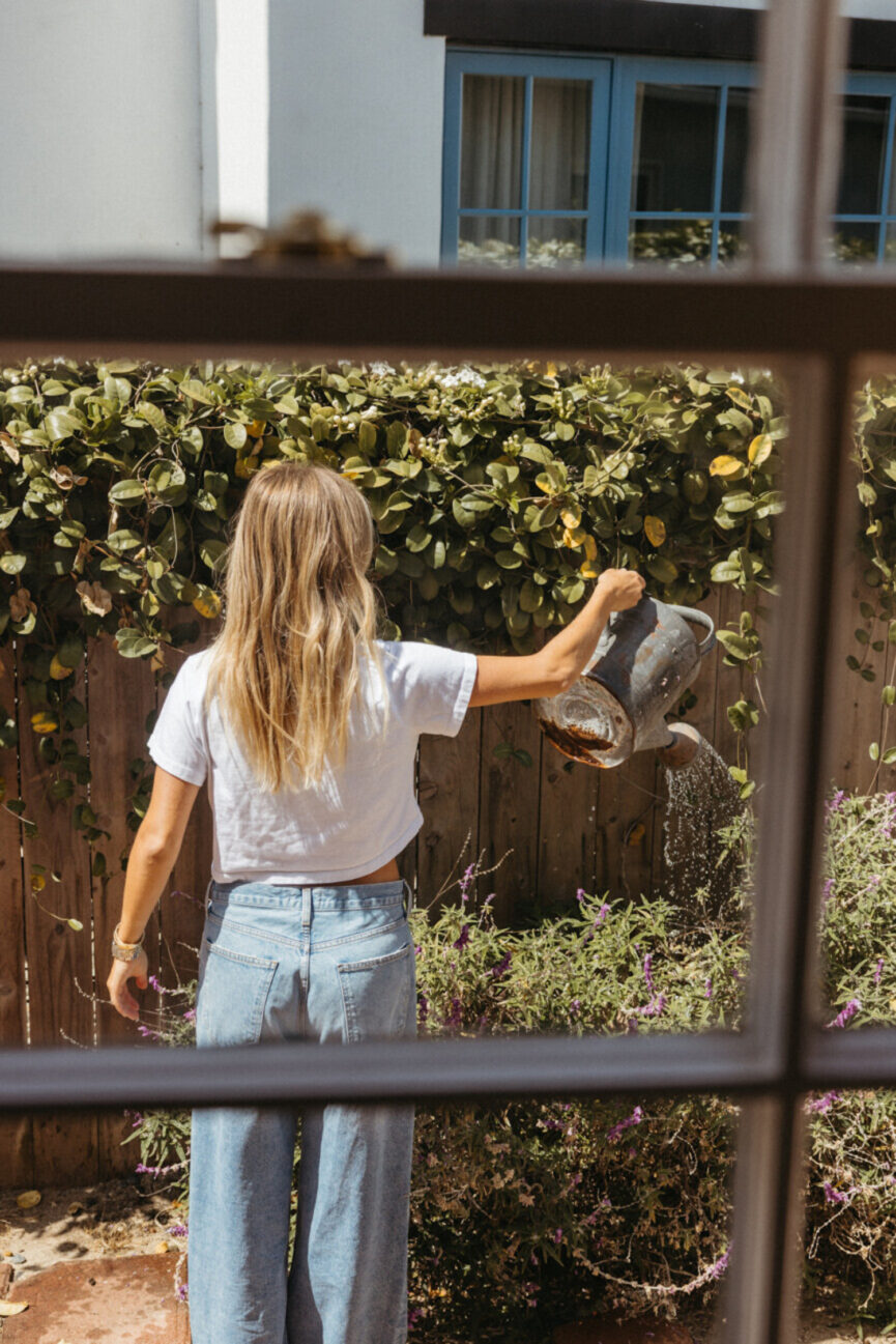 Woman gardening on a summer solo date.