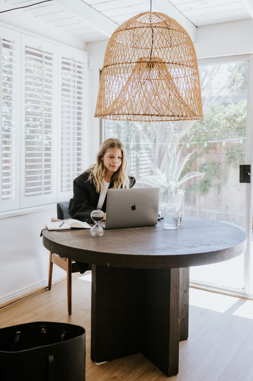 Woman working on Friday productivity list.