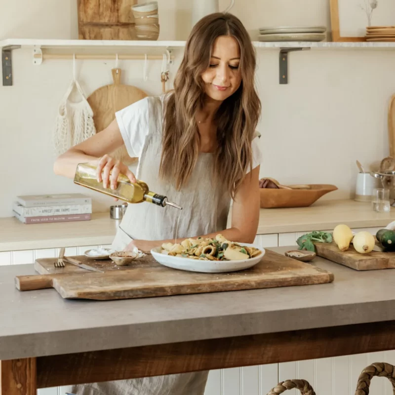 camille styles pouring olive oil