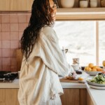 Woman cookin gin kitchen