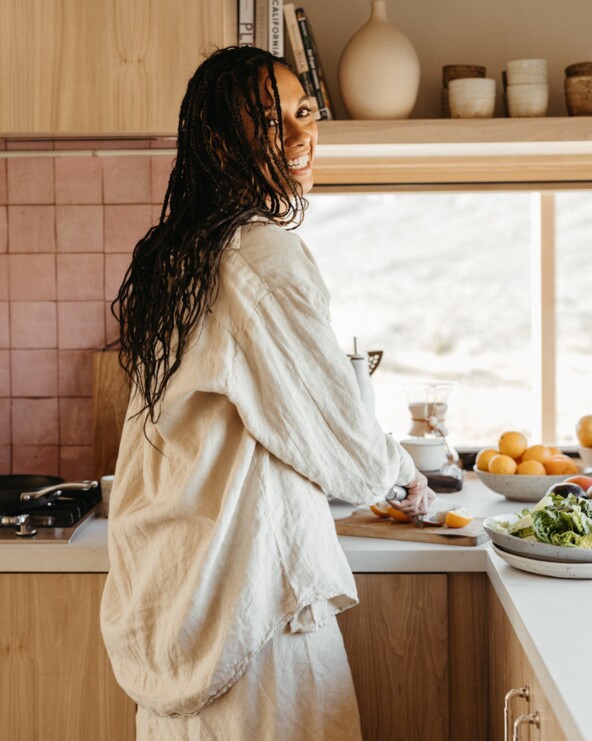 Woman cookin gin kitchen