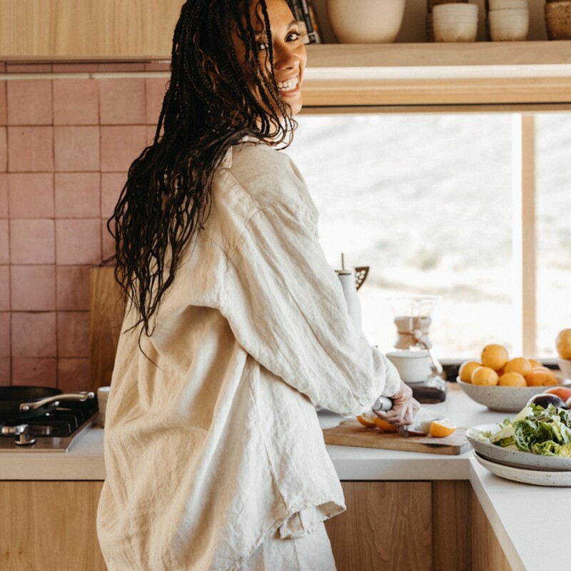 Woman cookin gin kitchen