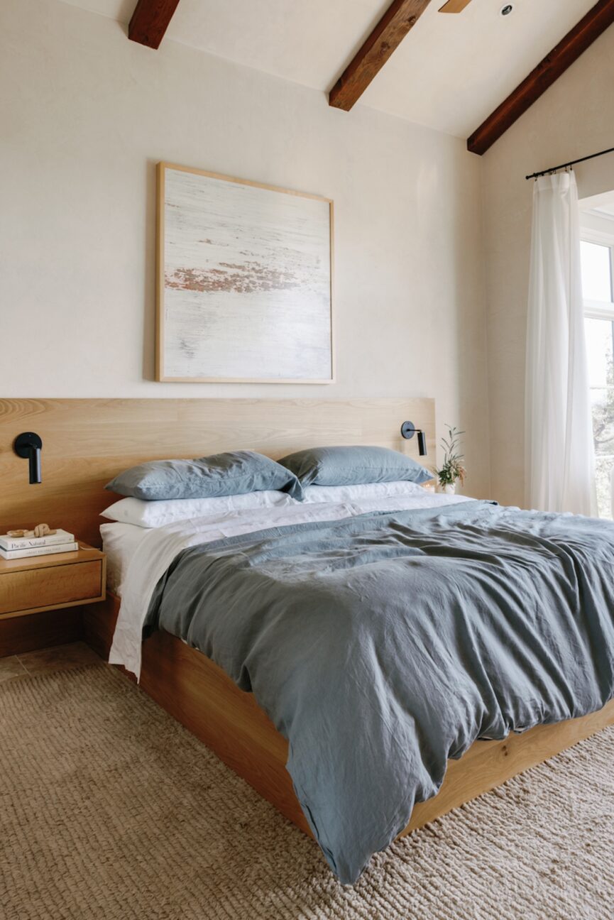 Airy bedroom with blue duvet cover.