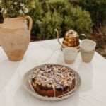 blueberry cornmeal cake with almond crumble and lemon glaze